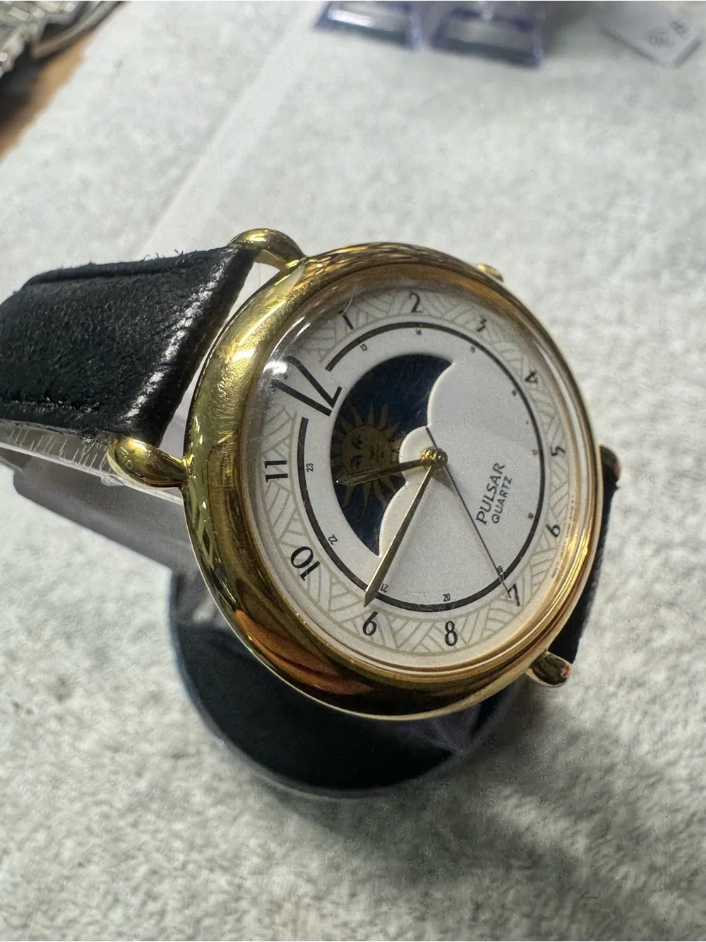 Pulsar Gold Tone Watch with White Dial and Black Strap